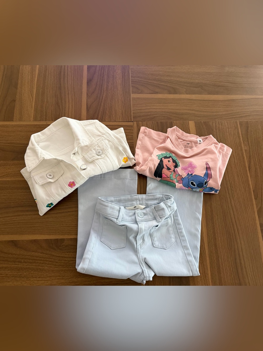 H&M Pink Lilo & Stitch Graphic Tee with Light Blue Jeans and White Jacket 5T
